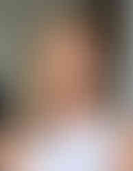 a bride after getting hair and makeup done at her bridal preview. her hair is done in classic waves with a side part