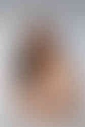 bride smiling at the camera after getting hair and makeup done at bridal preview