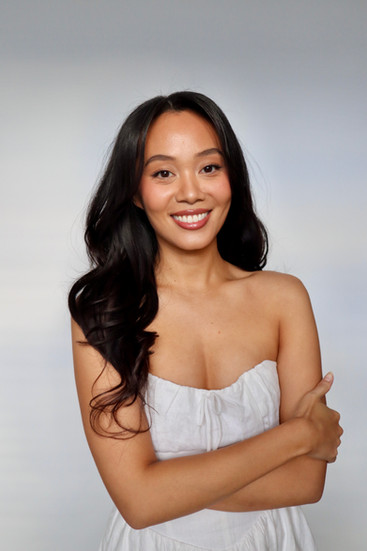 bride smiling at the camera after getting hair and makeup done at bridal preview