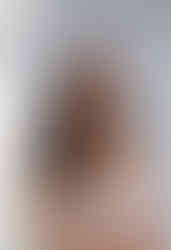 bride posing in front of camera at Baltimore studio