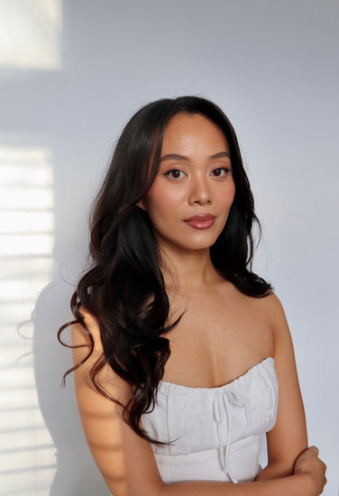 bride posing in front of camera at Baltimore studio