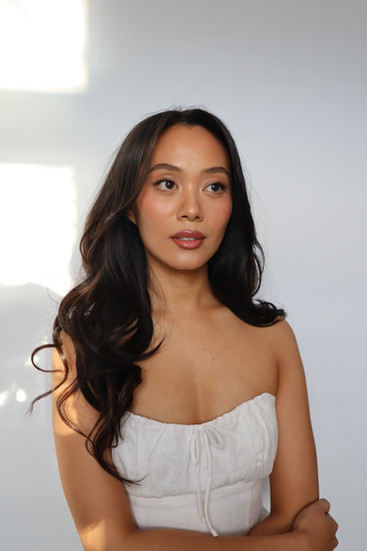 bride posing in front of camera after hair and makeup
