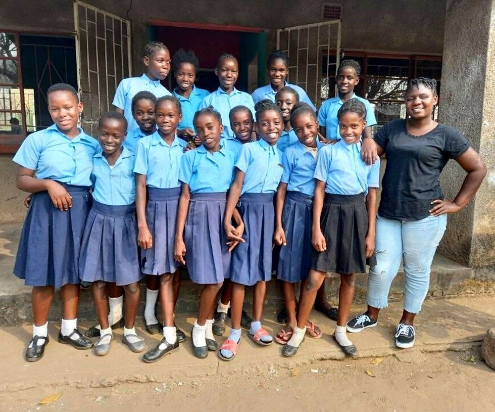 Mentor Prisca with girls from Yosefe and Matula Girls Club, Mfuwe, Zambia