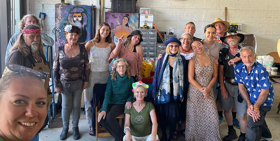 Some Our Workshop Crew 2026 after our last official "meeting" before the Parade. Left to right: Olivia Sorgman (In the left corner who was taking the picture) Jim Sun Bear (a partially visible Beau Wilding behind Jim Sunbear), Claudia Bratton, Natalie Richardson, Tara Brooks, Brenda Galloway. Emma Jane Huerta (EJ sitting on the floor) Penny Little, Irene Ramirez, Nobeel Masri (behind Irene) Chloe Villanueva, Adriana Reyna (Behind Chloe) , Andrew Stevens (behind Adriana) Richard O'Steen, Riccardo Morrison. Missing from this picture are Workshop staff and volunteers: Justine Pannier, Pali X-Mano, Carlos Cuellar, Allison Claudio, Hope Christofferson, Shelly Woods, Nicole Caldwell, Jeremy Lamb, and a few others .