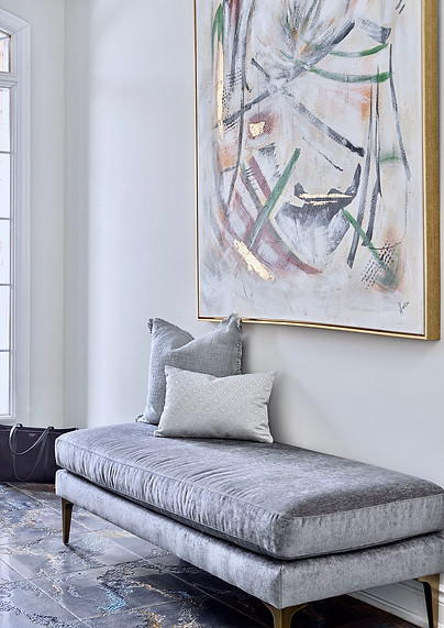 Foyer with bench and oversized wall art