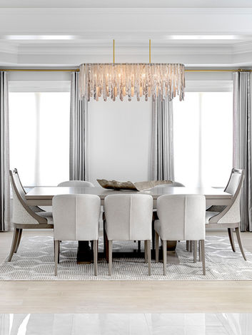 Sophisticated dining room featuring a muted, calming palette, with elegant furnishings and timeless detailing