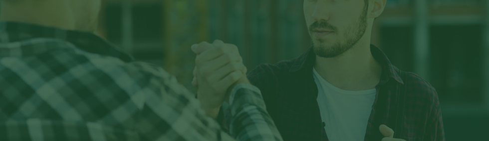Happy auto repairman handshaking with customer in a workshop (6).png
