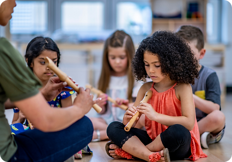 Several children learning to play wind instruments