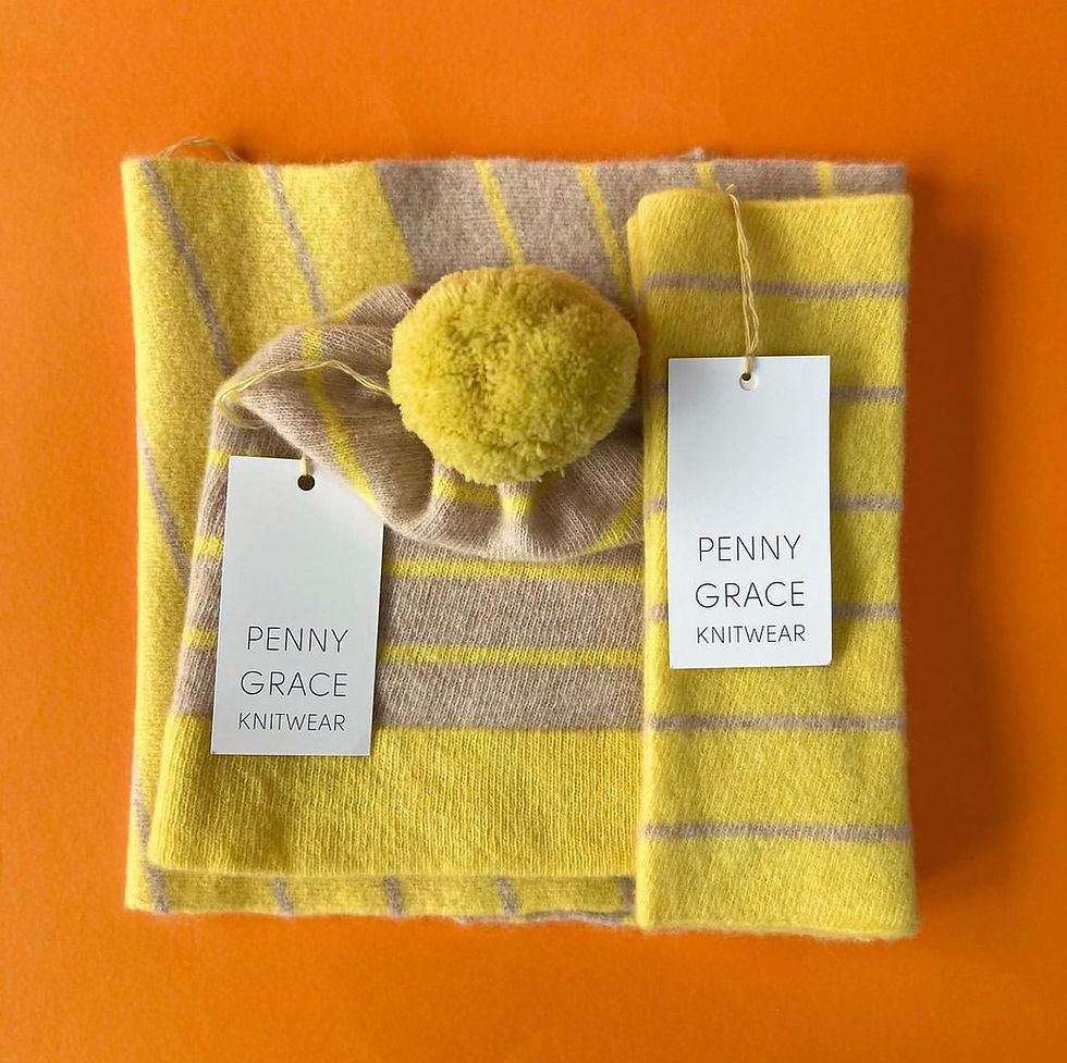 Thumbnail: Colourful Merino wool fingerless gloves in yellow shown with matching beanie and snood orange background