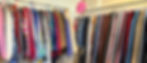 Colorful racks of clothing that can be found within the Resouled Threads storefront