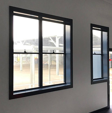 Double hung window with a black aluminium frame