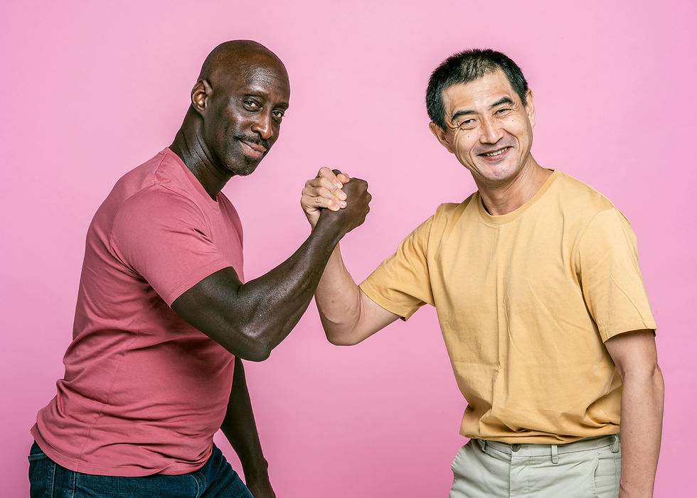 Two friends joyfully shaking hands against a lively pink background, celebrating their friendship with smiles.
