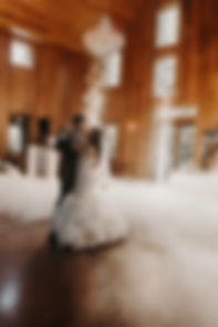 Bride and groom dancing with fog and sparklers at wedding reception