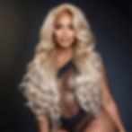 Model wearing 5, 30 inch 613 light blonde Virgin Body Wave hair bundles front view.