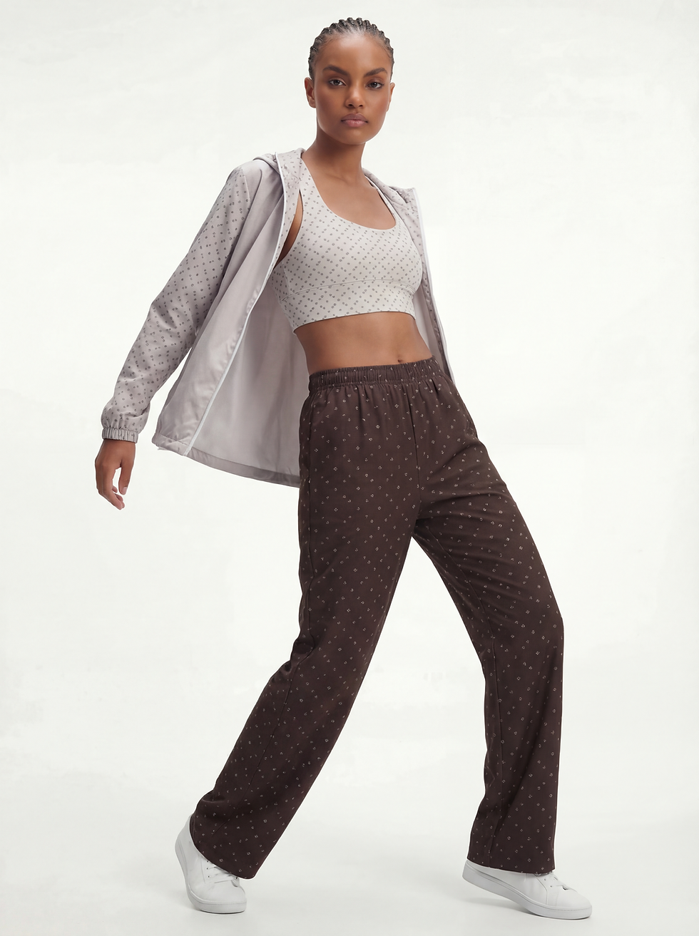 Women’s oversized lightweight windbreaker in Cloud with water-resistant fabric, breathable mesh lining, hood, and zip front.