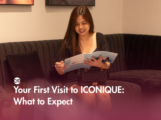 A woman reading ICONIQUE's service catalog while seating on their lobby chair.