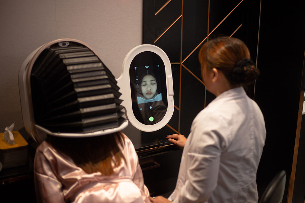 A person inside a Skin Analysis machine, with a woman in a white lab coat overseeing the procedure.