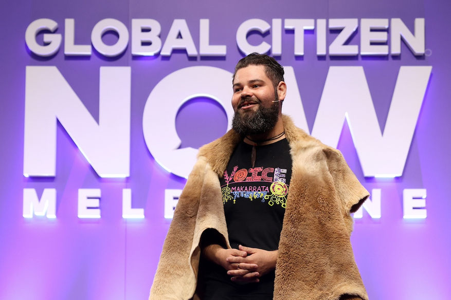 Jesse Fleay in a fur cape against a purple background
