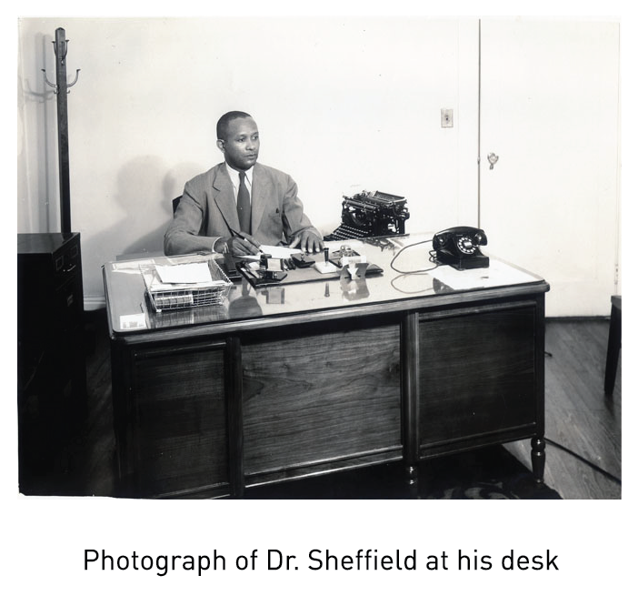 Photograph of Dr. Sheffield at his desk