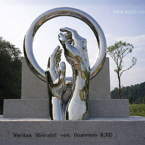 Mirror-polished forged stainless steel sculpture with stone base