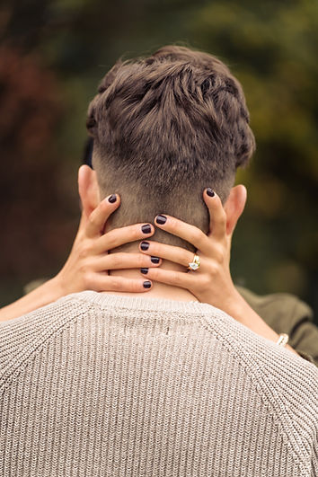 Portrait of a couple emphasizing wedding ring