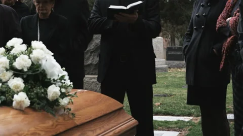 priest-giving-eulogy-funeral-footage-043094541_iconl.webp