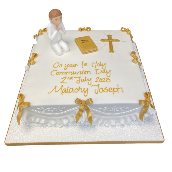 A beautiful and elegant Communion Day cake with white icing and delicate decorations, perfect for celebrating this special religious occasion.