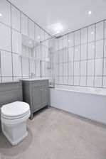 minimalist bathroom installation featuring monochramic design 