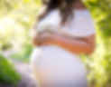 pregnant woman standing near green plants_edited_edited.jpg