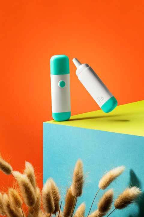 Minimalist product photography of health and wellness medical product floating in modern studio setting above allergens
