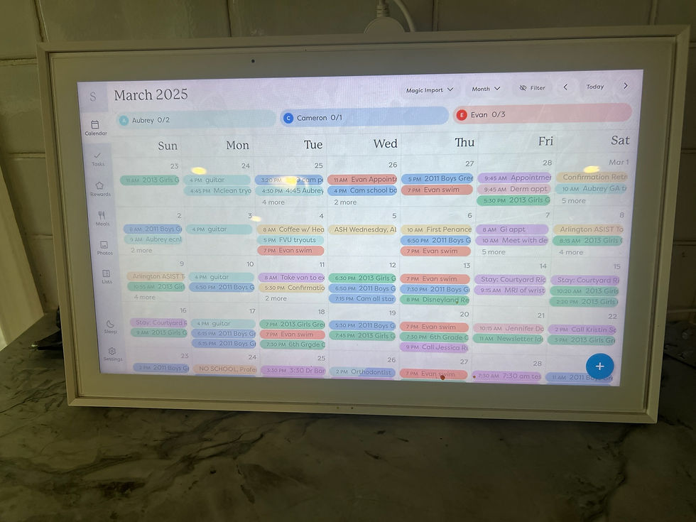 Digital calendar for March 2025 on a tablet screen, displaying colorful event entries and reminders in various pastel shades on a countertop.