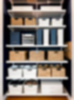 Newly upgraded elfa closet system for home office with decor shelves and fascia.