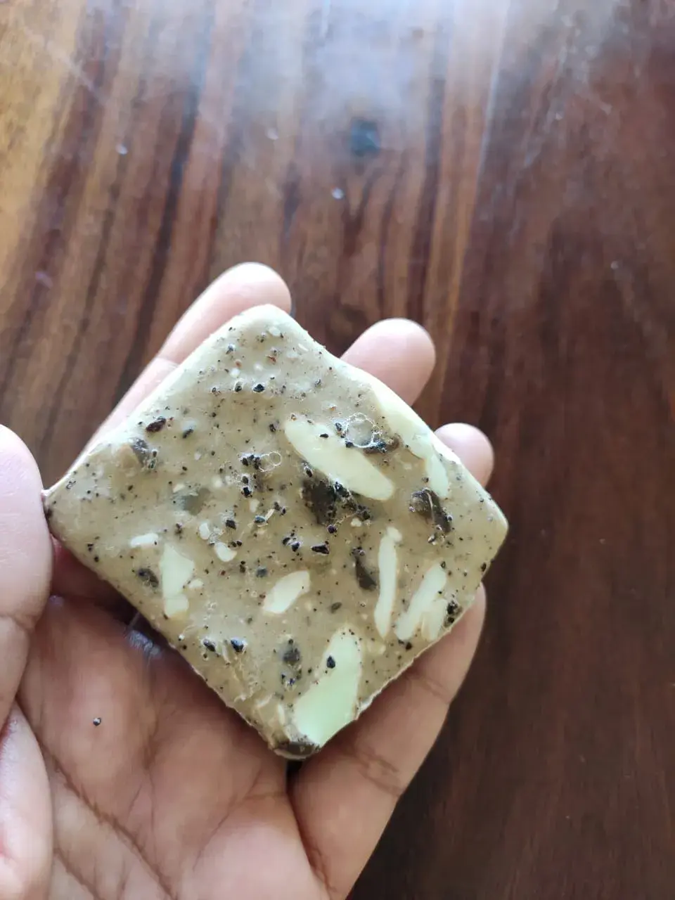 Homemade scrub soap with coffee grounds and a leftover soap pieces