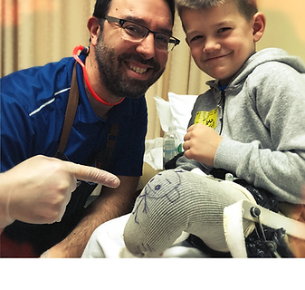 child getting fitted for leg prosthetc