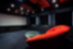 Comfortable red sofa in a dark interior.jpg