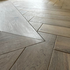 grey parquet herringbone floor installed in Prescot home
