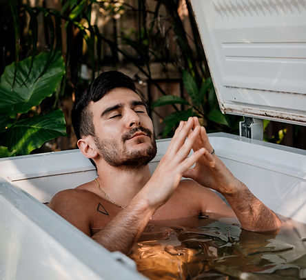 A man smiling and calmed during outdoor Ice Bath