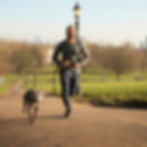 man jogging with dog