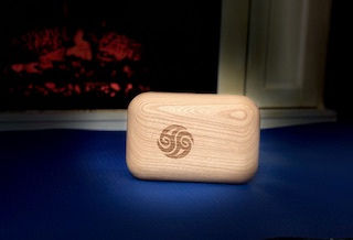 Wooden block therapy block on a foam mat in front of a fireplace