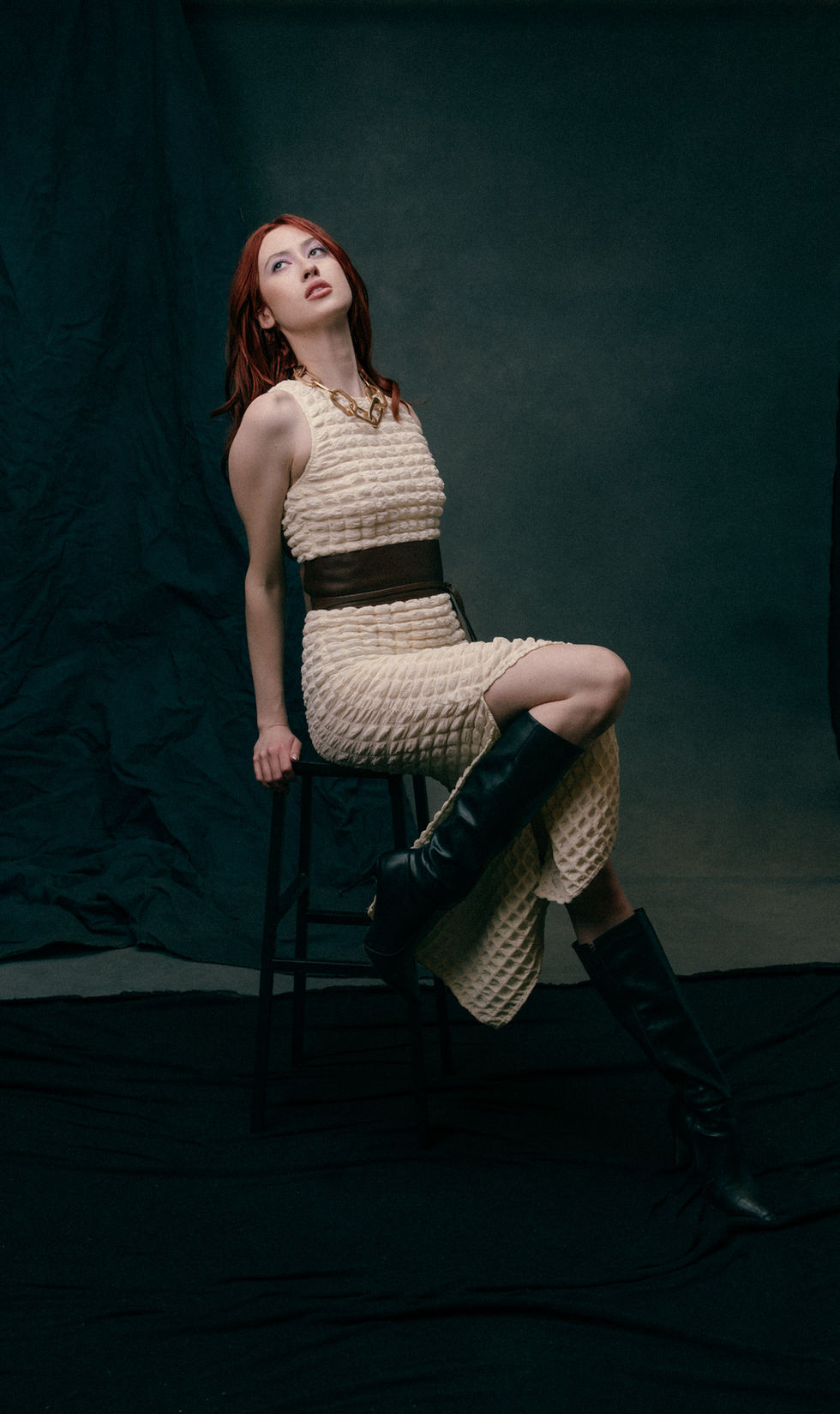 Intimate editorial portrait of redhead model with soft dramatic lighting close up | Commapix Studio
