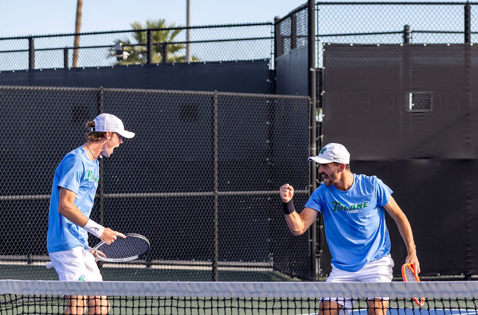 Tulane University tennis players AJ Mercer and Asaf Friedler celebrating a point.