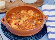 There are many dishes, both fish and meat, that are described as al ajo arriero; what they all have
in common are vinegar, garlic, and paprika. In this version, the contrasting tastes of the sweet
vegetables and the dried cod are winning. This dish often calls for shredded cod, but in this
version, it is left whole. It will, however, break into large pieces as it cooks.
Adapted from Delicioso by Penelope Casas