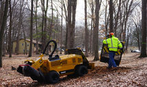 Using stump grinding machinery to clear a stump in Grand Rapids, Michigan.