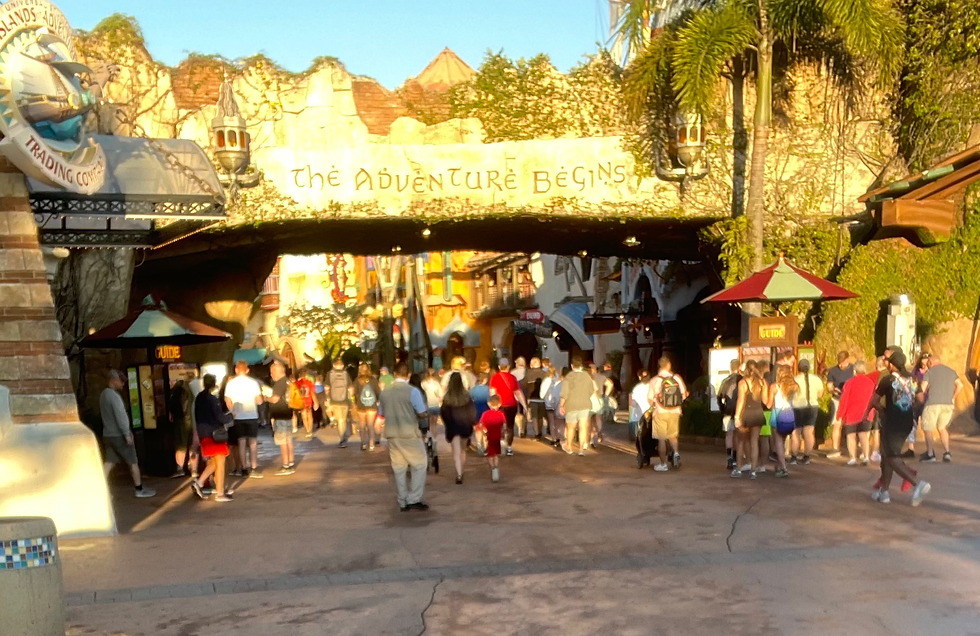 Entry with words "The Adventure begins" and people walking under it.