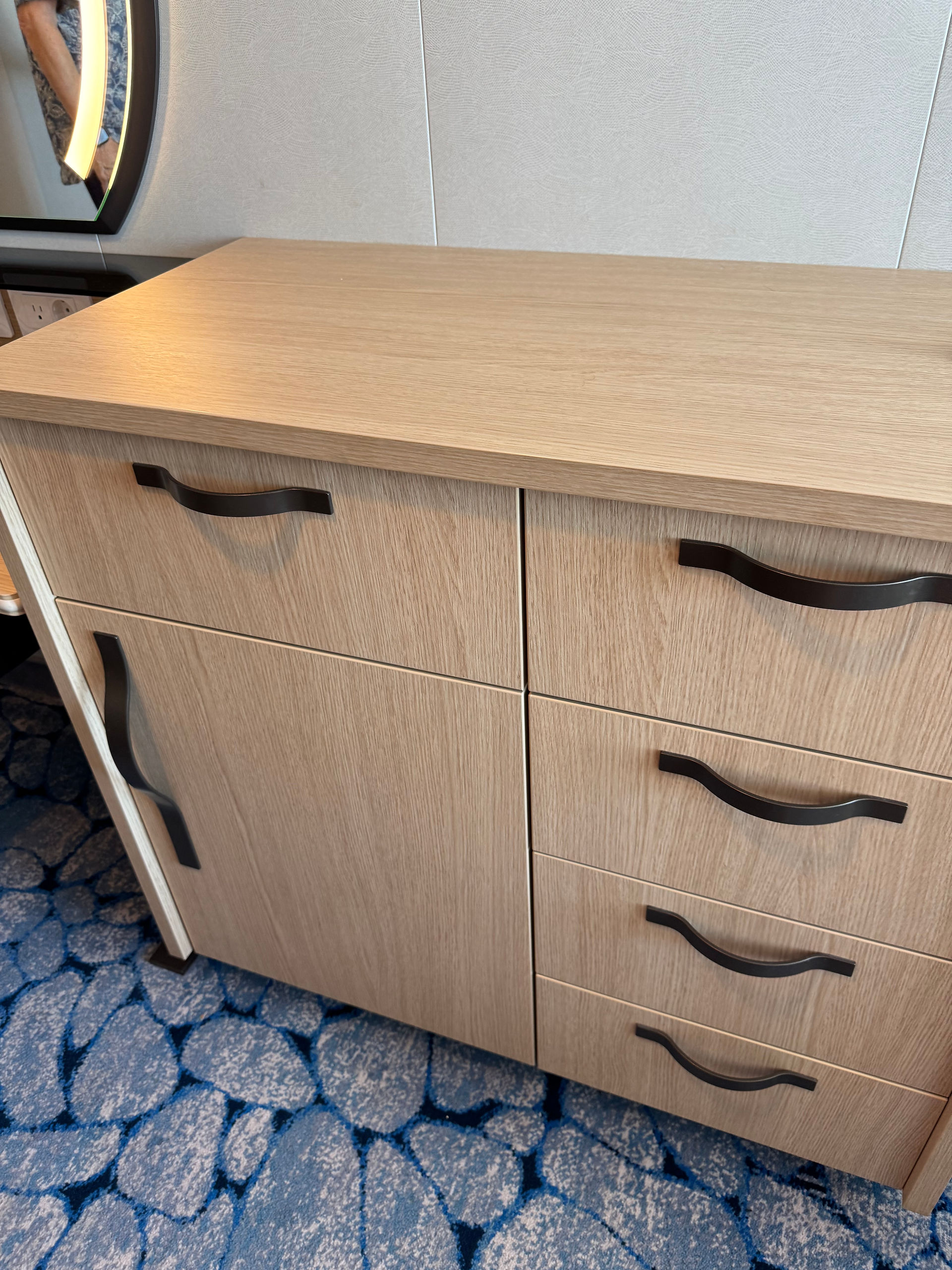 chest of drawers against the wall