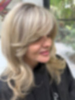 Signature blonde hair transformation with soft dimensional foils and creamy cool blonde tones
