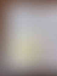 First sketch and description for ideation purposes. A sticky note has a pencil sketch of a soft alien-looking toy called Happi