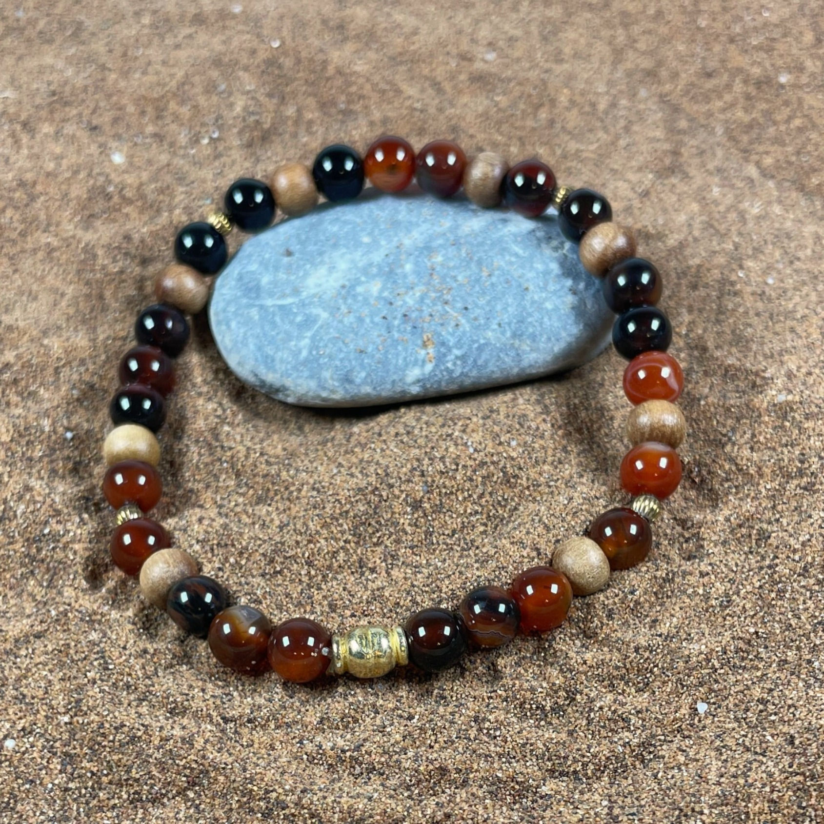 Falkenauge, Sandelholz, vergoldete Silberteile, 6 mm