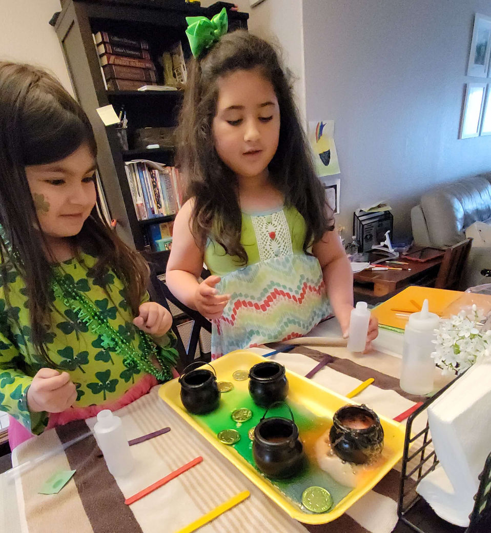 Two girls are playing with experiment.