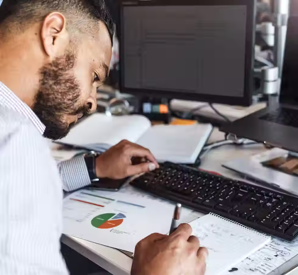 Taking Notes on Financial Report.jpg.avif